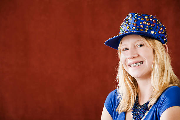 Young girl laughing with braces on her teeth
