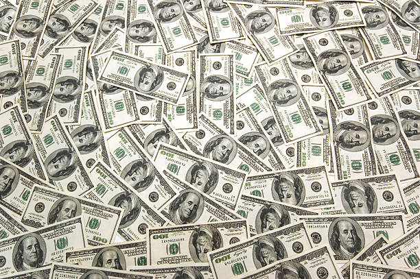 istock Lots of dollar bank notes on the table 92274913