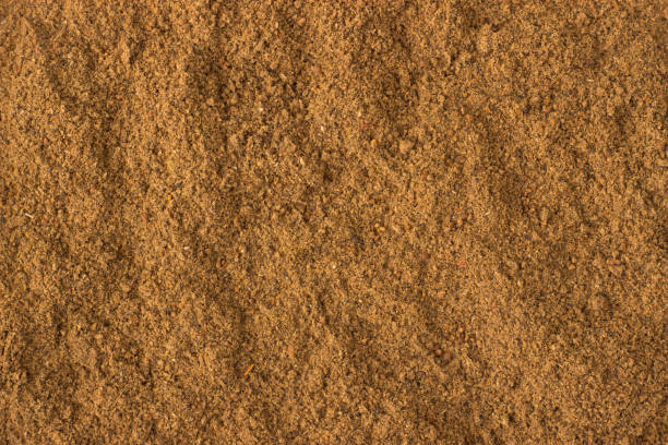 istock ground nutmeg powder spice as a background, natural seasoning texture 922751676