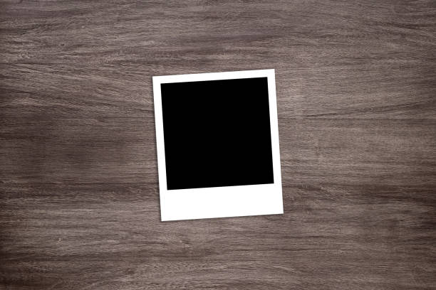 istock blackened instant photo print template on wooden background 922752276