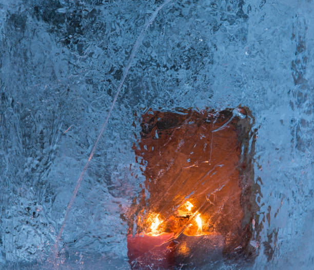 istock three candles and a bible on ice 922754682