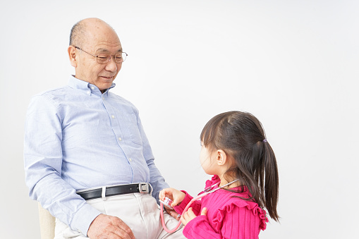 Grandfather playing with child