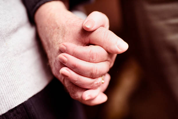 istock Senior couple holding hands 922755080