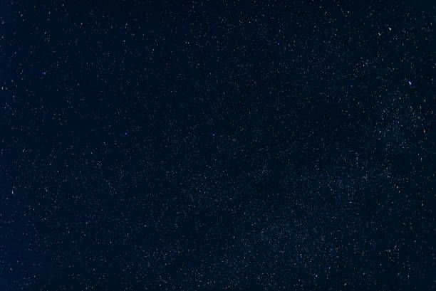 istock stars on dark blue sky background at night with milky way 922755662