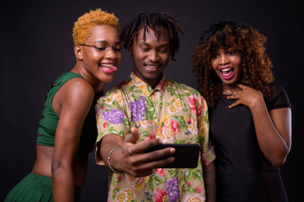 istock Group Of African People Using Mobile Phone And Taking Selfie 922756024