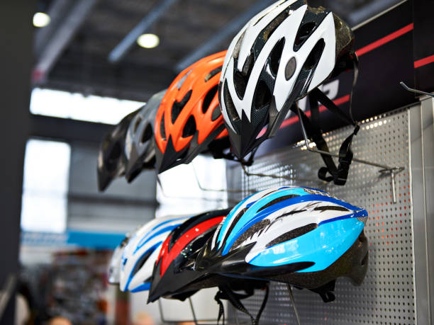 istock Modern protective sport helmets for cyclists in store 922756234