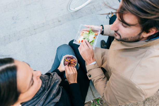 istock Business people having lunch break outdoors 922757098