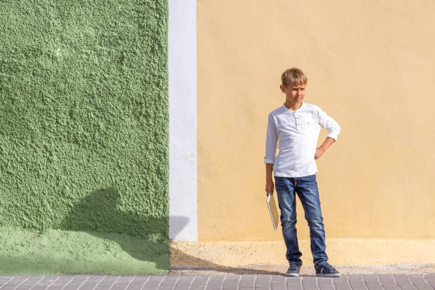 istock Child holding tablet computer outdoors 922761396