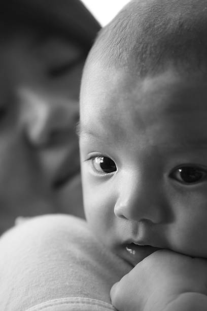 istock Two months old baby resting on  monther’s shoulder 92276148