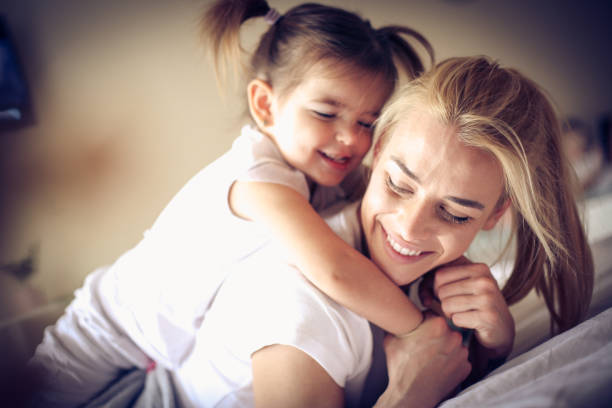 istock Playing with mommy. Little girl. 922762124