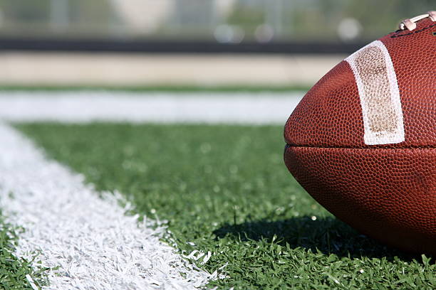 istock Collegiate football on the field 92276564