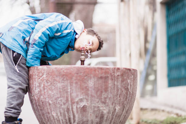 Mixed race boy outdoors, close up portrait