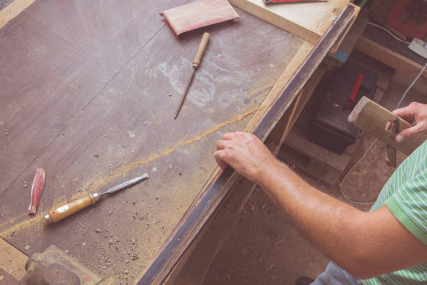 istock Carpenter working on the wood in his shop. 922769426
