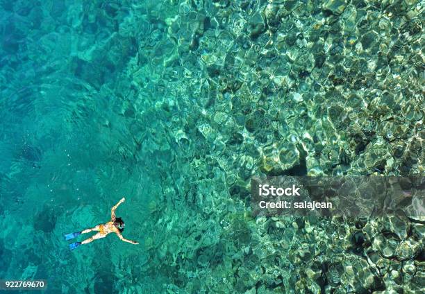 Woman Snorkeling In Sea Water Aerial View Stock Photo - Download Image Now - Zanzibar, Snorkeling, Snorkel