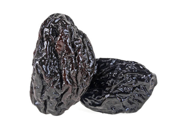 istock Smoked prunes isolated on a white background, close-up 922770922