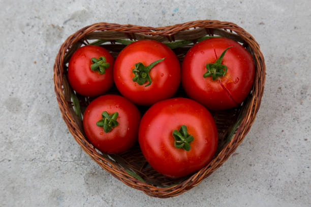 istock Freh tomato in heart shaped basket 922770962