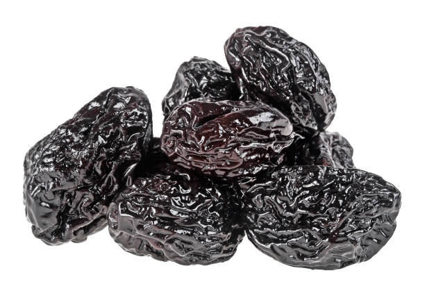 istock Smoked prunes isolated on a white background, close-up 922770970