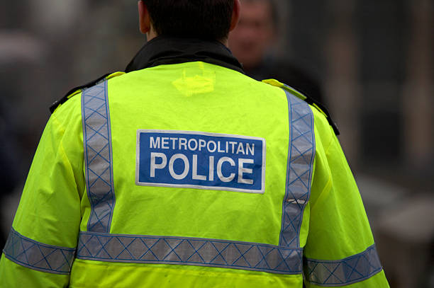 Back view of metropolitan police officer  metropolitan police stock pictures, royalty-free photos & images