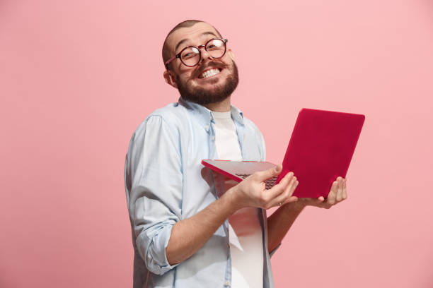 businessman hugging laptop - business men humor macho imagens e fotografias de stock