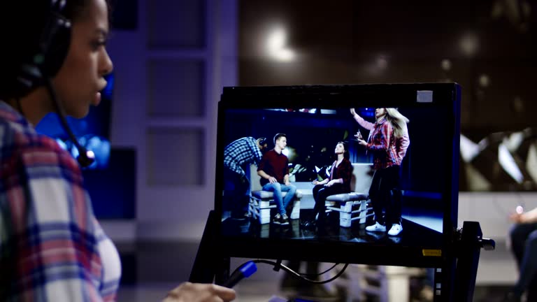 Stage director watching show in record