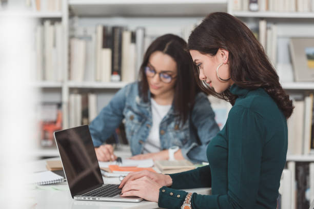 istock multicultural friends preparing to exam in library 922773142