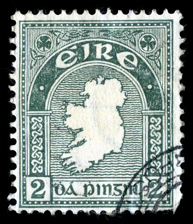 London, UK, February 19 2018 - Vintage 1922 green map of the Republic of Ireland (Eire) cancelled postage stamp