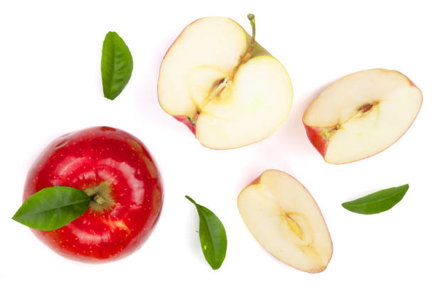 istock red apples with slices and leaves isolated on white background top view. Set or collection. Flat lay pattern 922775908