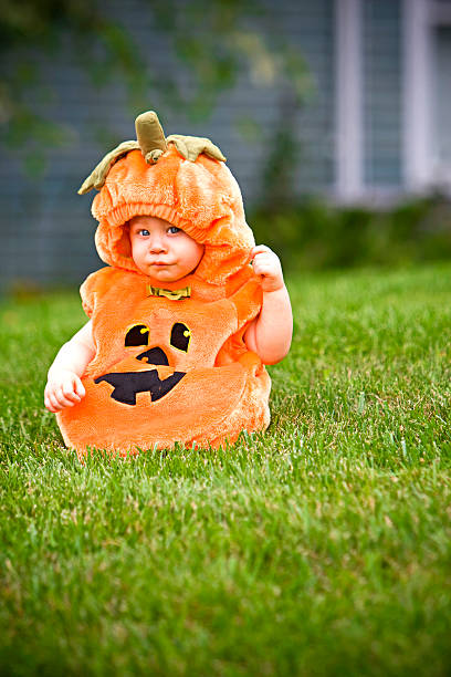 istock Boy in pumpkin costume 92277631
