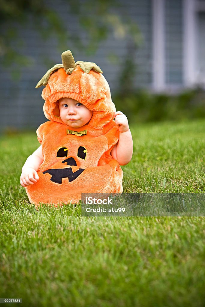 Boy in pumpkin costume  Baby - Human Age Stock Photo