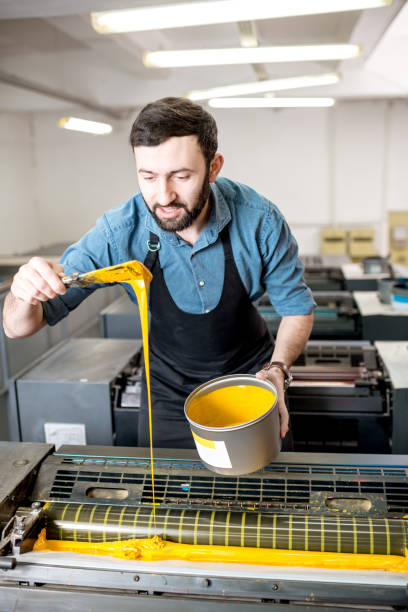 istock Typographer with paint at the manufacturing 922778656