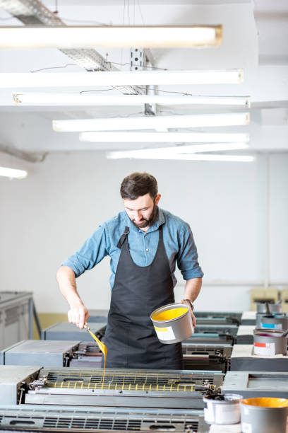 istock Typographer with paint at the manufacturing 922779026