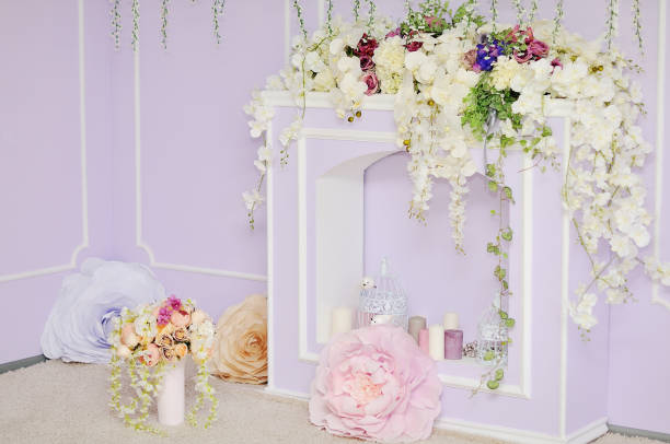 istock Fireplace decorated with flowers. 922779752