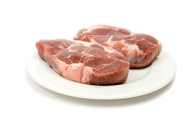 Fresh raw pork isolated on white stock photo