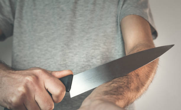 istock Caucasian man with knife. Suicide concept. 922780506