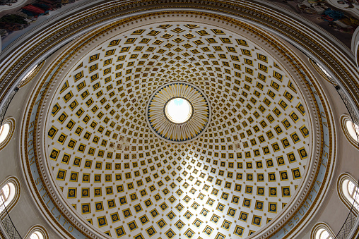 Mosta, Malta - 1 November 2017: The interior of the dome in Mosta church on Malta, one of the largest domes in the world