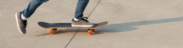 istock skateboarder legs skateboarding at skatepark 922781252