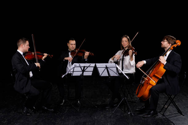 string quartet performing - 4 string imagens e fotografias de stock