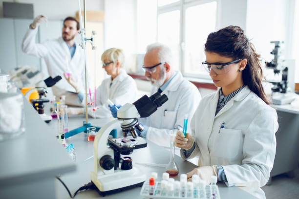 istock Team of scientists in research laboratory conducting science experiments 922781908