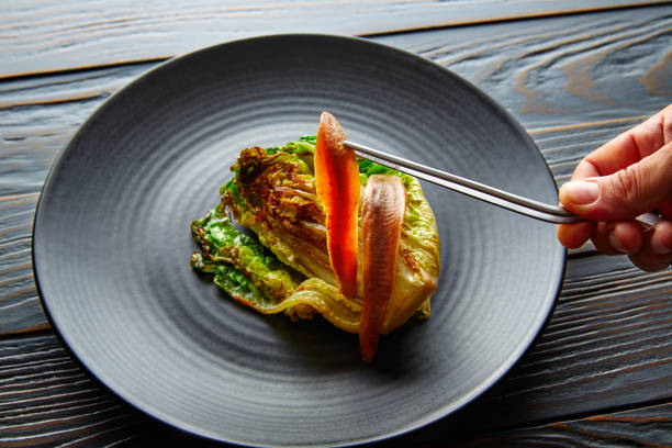 istock Cantabrian anchovies with endive chef hand 922783994
