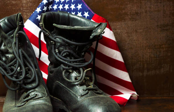 istock Old military boots and USA flag 922784222
