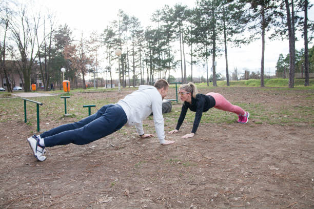 istock Young woman and man exercise together 922784880