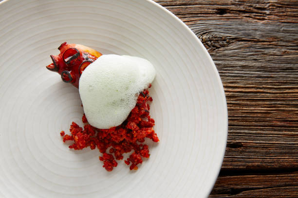 istock Grilled octopus with parsley air foam 922785814