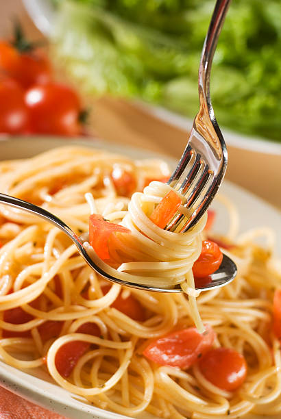 istock Twirling spaghetti noodles with a fork and spoon 92278823
