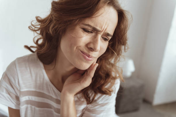 istock Frustrated woman struggling with toothache 922788464