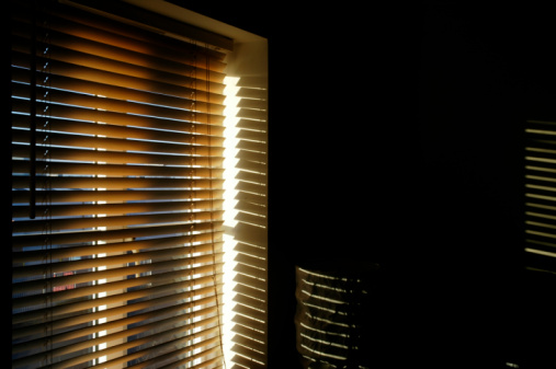 Wooden blinds grey color, 50mm slats, venetian. Wood blinds closeup on the window.