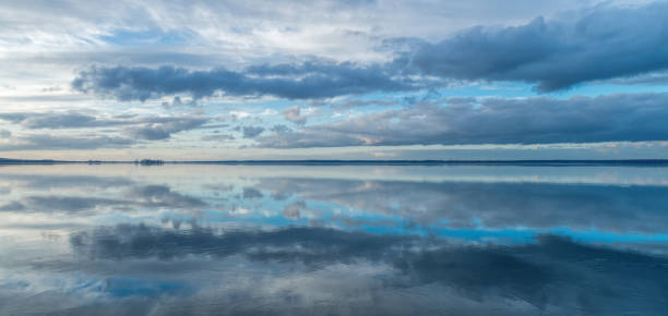 istock Panoramic view on lake Steinhuder Meer with majestic cloudscape at dusk 922791450