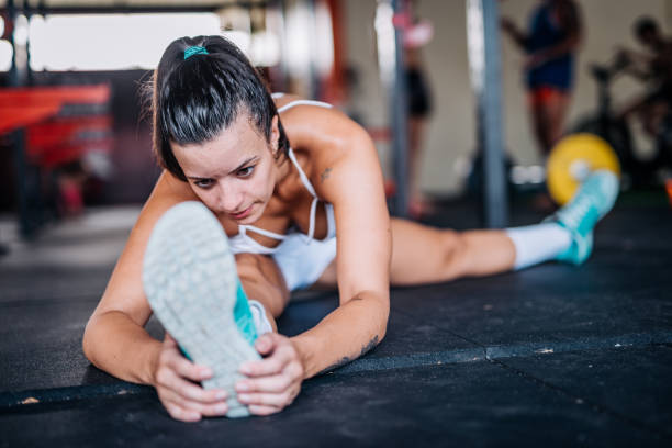 istock Beautiful Brazilian woman stretching during cross training 922792506