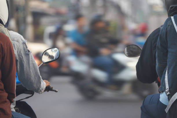 istock motocycles with riders wait for go light sign on cross junction road with passengers ,back view 922792634