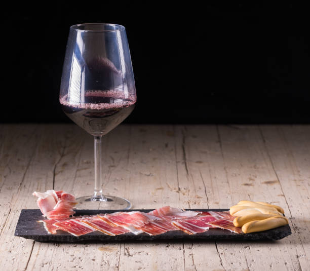 spanish tapas, iberian loin, sausage. iberian acorn ham and wine - serrano chilli pepper meat ham spain imagens e fotografias de stock