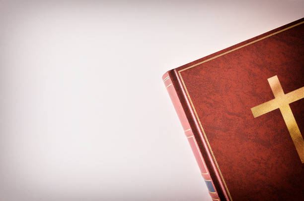 istock Brown leather cover of a Bible beside a table 922798464